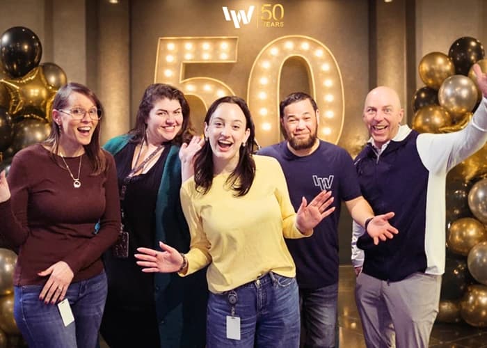 Image of IW team celebrating our 50th year.