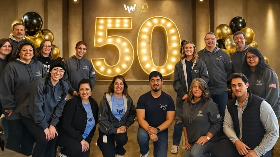 Blue tinted image of IW team in meeting