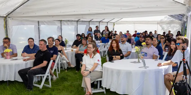 IW Technologies Employees Watching Al Moorhouse Speak IW Technologies employees watch founder Al Moorhouse speak at the 50th anniversary celebration during Employee Appreciation Week.