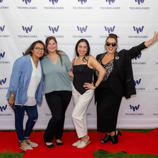 Rolling Out the Red Carpet for Our Team IW Technologies team members pose on the red carpet at Employee Appreciation Week.