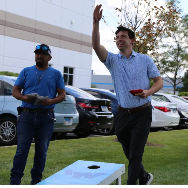 IW celebrating at annual employee appreciation week, playing in bags tournament